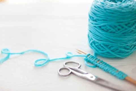 The beginning of the knitting process. A set of loops on knitting needles. White Stock Photos