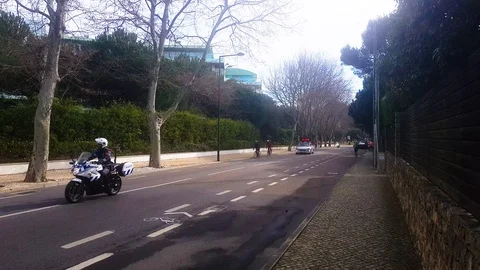 The beginning of the marathon. A car with a chronometer passes by police Stock Footage 104132594