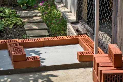 Beginning of masonry with bricks Stock Photos