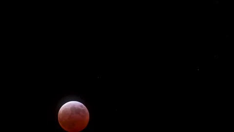Beginning of the maximum Total Lunar Eclipse on March 14th, 2025 as the moon Stock Footage 304669088