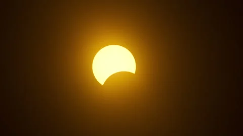 Beginning of partial solar eclipse time lapse closeup Stock Footage 271368483