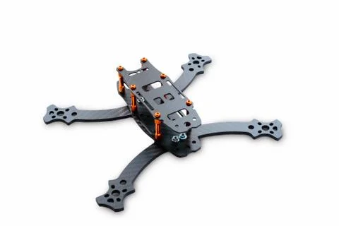 The beginning of the racing drone assembly. A robust frame of an unmanned aer Stock Photos