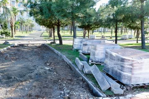 Beginning reconstruction of sidewalk - construction work at  initial stage. Stock Photos