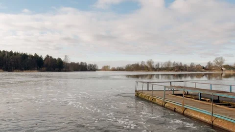 The beginning of spring. jetty on the lake in the ice. Video stock 104288303