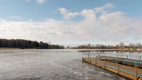 The beginning of spring. jetty on the lake in the ice. Stock Footage 104290243