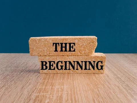 The beginning symbol. Brick blocks with text THE BEGINNING. Stock Photos