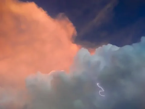 Beginning of Thunderstorm lightning - tiny thunder lighting with clouds aroun Foto stock