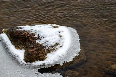 Beginning of the winter, Ice forms on the vegetation across the river. Stock Photos