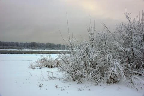 Beginning of winter landscape by the river first snow Stock-Fotos