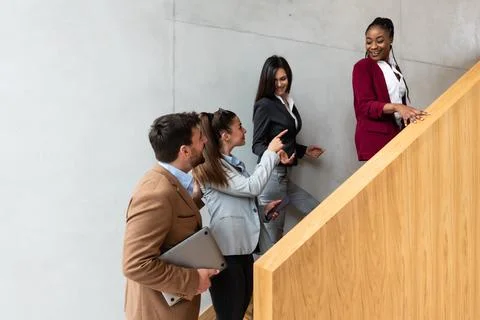 Beginning of the working day. Group of young business people, office worker.. Stock Photos