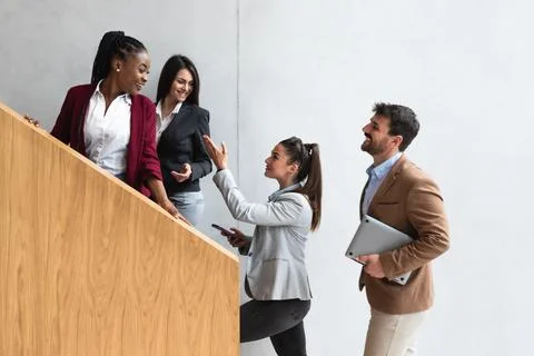 Beginning of the working day. Group of young business people, office worker.. Stock Photos