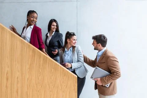 Beginning of the working day. Group of young business people, office worker.. Stock Photos