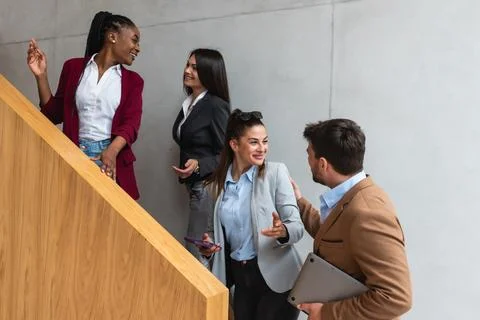 Beginning of the working day. Group of young business people, office worker.. Stock Photos