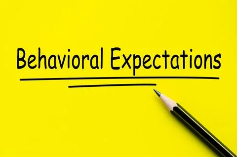 Behavioral Expectations text on yellow notepad with pencil background Stock Photos
