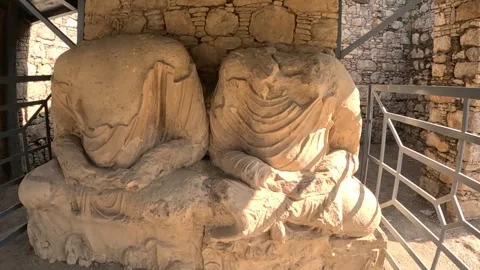 Beheaded Buddha statues at Mohra Murad Monastery, Taxila, Pakistan Stock Footage 320591118