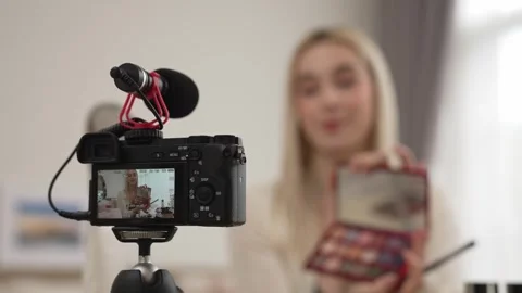 Behide camera screen display woman making beauty tutorial video. Blithe Video stock 274869803