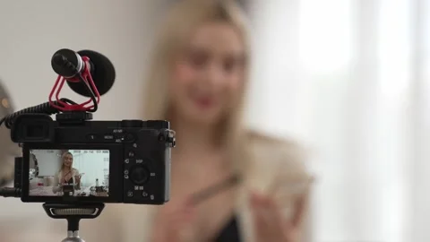 Behide camera screen display woman making beauty tutorial video. Blithe Video stock 274979397