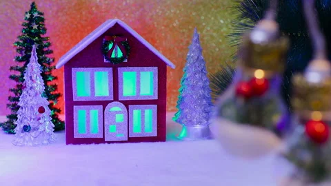 Behind the beautiful large lights decorated inside is a red house Stock Footage 324465104