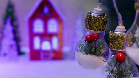 Behind the beautiful large lights decorated inside is an orange-blue house Video stock 324465139