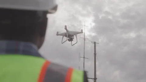 From Behind Blurred Operator Drone Does Power Line Inspection Stock Footage 208780469