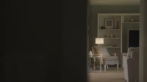 From Behind Blurred Wall View Down Hallway of Empty Living Room in Natural Light Video stock 208787381