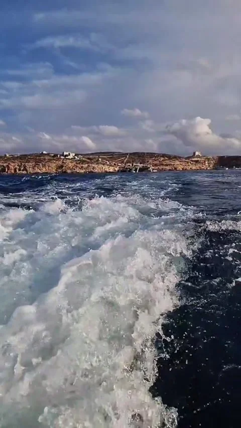 Behind the Boat Waves Form and Follow in This Captivating Ocean Video Stock Footage 289648270