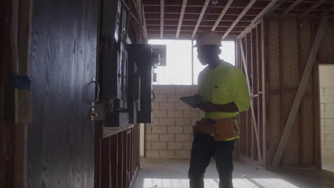 Behind Construction Worker Inspecting Electrical Panel Stock Footage 270390413