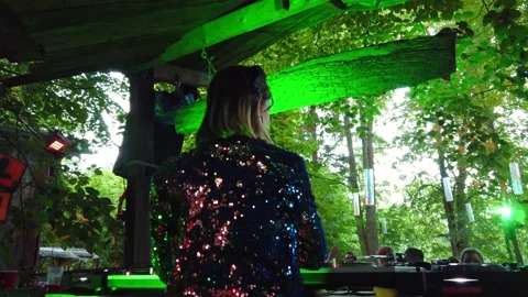 Behind DJ booth on a music techno festival in woods forest Stock Footage 220787855