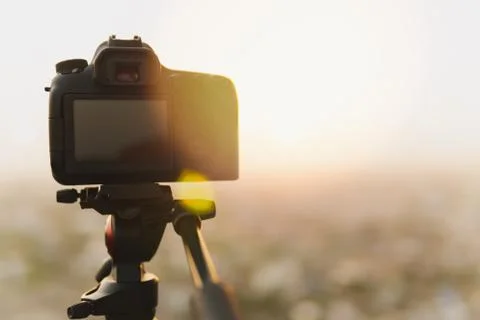 Behind the DSLR camera on a tripod Stock Photos