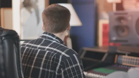 Behind Engineer at Recording Studio and Audio Board Stock Footage 89540705