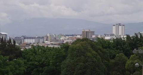 From behind the forest you can see the city. Costa Rica Stock Footage 82981246