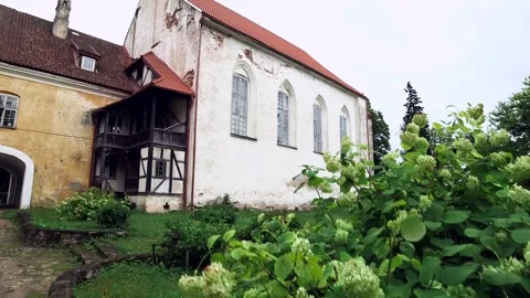 Behind the Hydrangea Bush is Part of Ancient Medieval Castle. Stock Footage 270353582