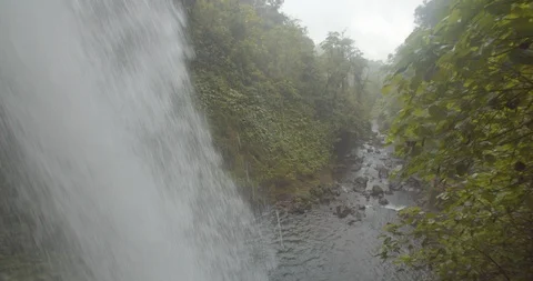 Behind Jungle Waterfall Stock Footage 107444485