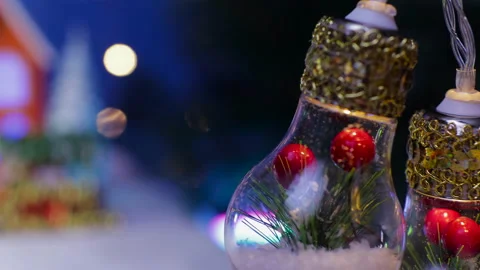 Behind the lights decorated inside is house surrounded by Christmas trees Stock Footage 324463161