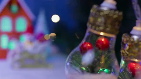 Behind the lights decorated in the middle, an orange house with a snowman Video stock 333643084