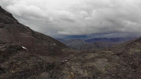 Behind the pass there is a beautiful view of the mountain valley Stock Footage 221944833
