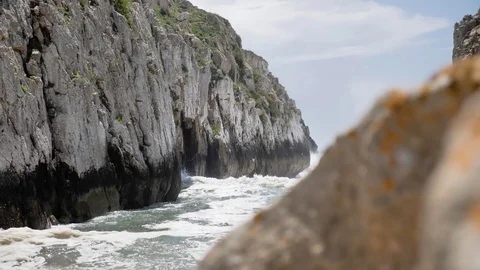 Behind Rock Ocean View Slowmotion 4k Stock Footage 77249848