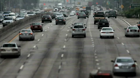 Behind rush hour traffic divided highway Stock Footage 821864