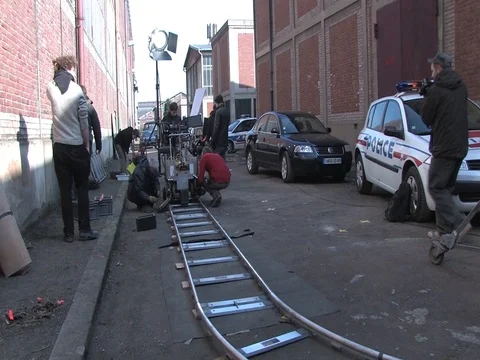 Behind the scene, film crew using a  travelling Stock Footage 71247048