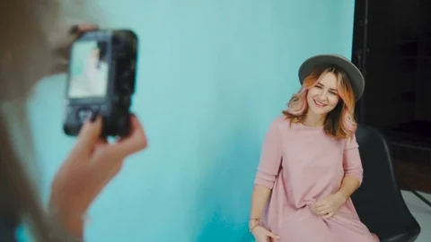 Behind the scene: two model girls are posing for a photographer Video stock 76428730