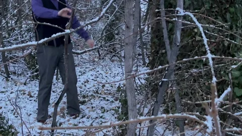 Behind the scenes Actor in Woods with Snow Fall Vídeos de archivo 150882559