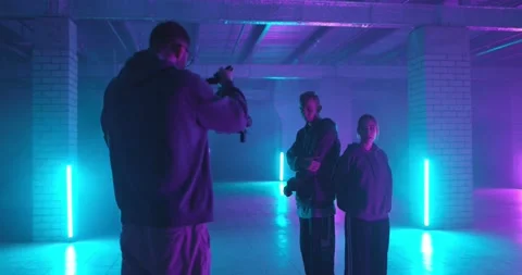 Behind the scenes. Backstage of video clip shooting. Cameraman filming hip-hop Stock Footage 197557633