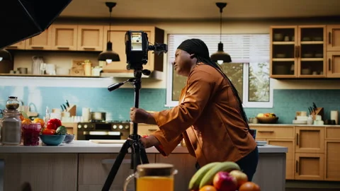 Behind the scenes, black home chef, filming setup, before recording Stock Footage 333610464