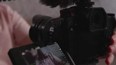 Behind the scenes of a blogger setting up a knitting video Stock Footage 337452024