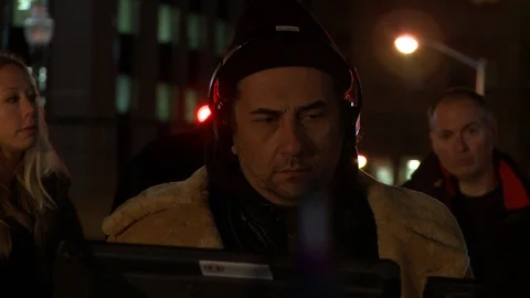 Behind the scenes (BTS) on a movie set in Detroit including Movie Helicopters Stock Footage 109200596