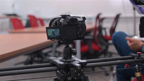 Behind-the-Scenes Commercial Interview Setup With Camera Slider Video stock 325324400