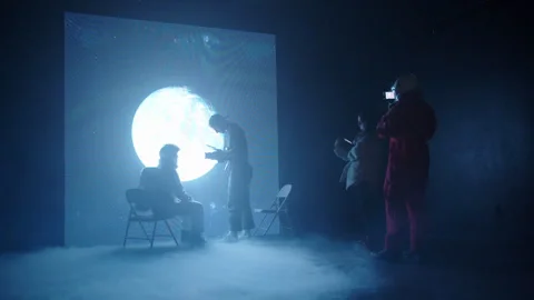 Behind the Scenes of Crew Shooting Scene in Studio with Astronaut by the Moon Stock Footage 270334060