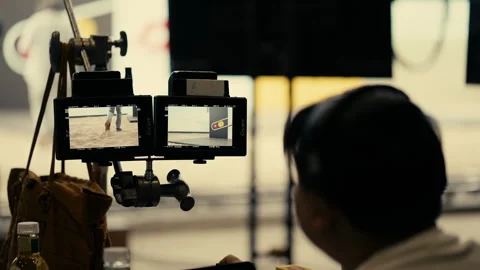 Behind the Scenes of Director Viewing Monitor at Film Production Shoot. Stock Footage 244844599