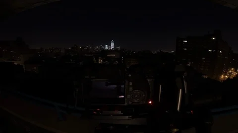 Behind-the-scenes elevated time lapse shot of city buildings at sunrise Stock Footage 99177692