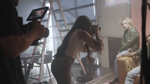 Behind the Scenes Footage of Camera Crew and Models on Set in a Studio Stock Footage 219575869